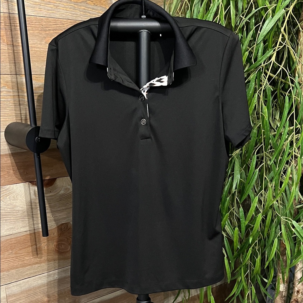 Greg Norman short sleeved golf polo with leopard print button placket. L